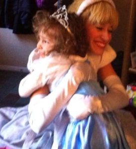 Cinderella gives Hannah a hug during her fourth birthday party.